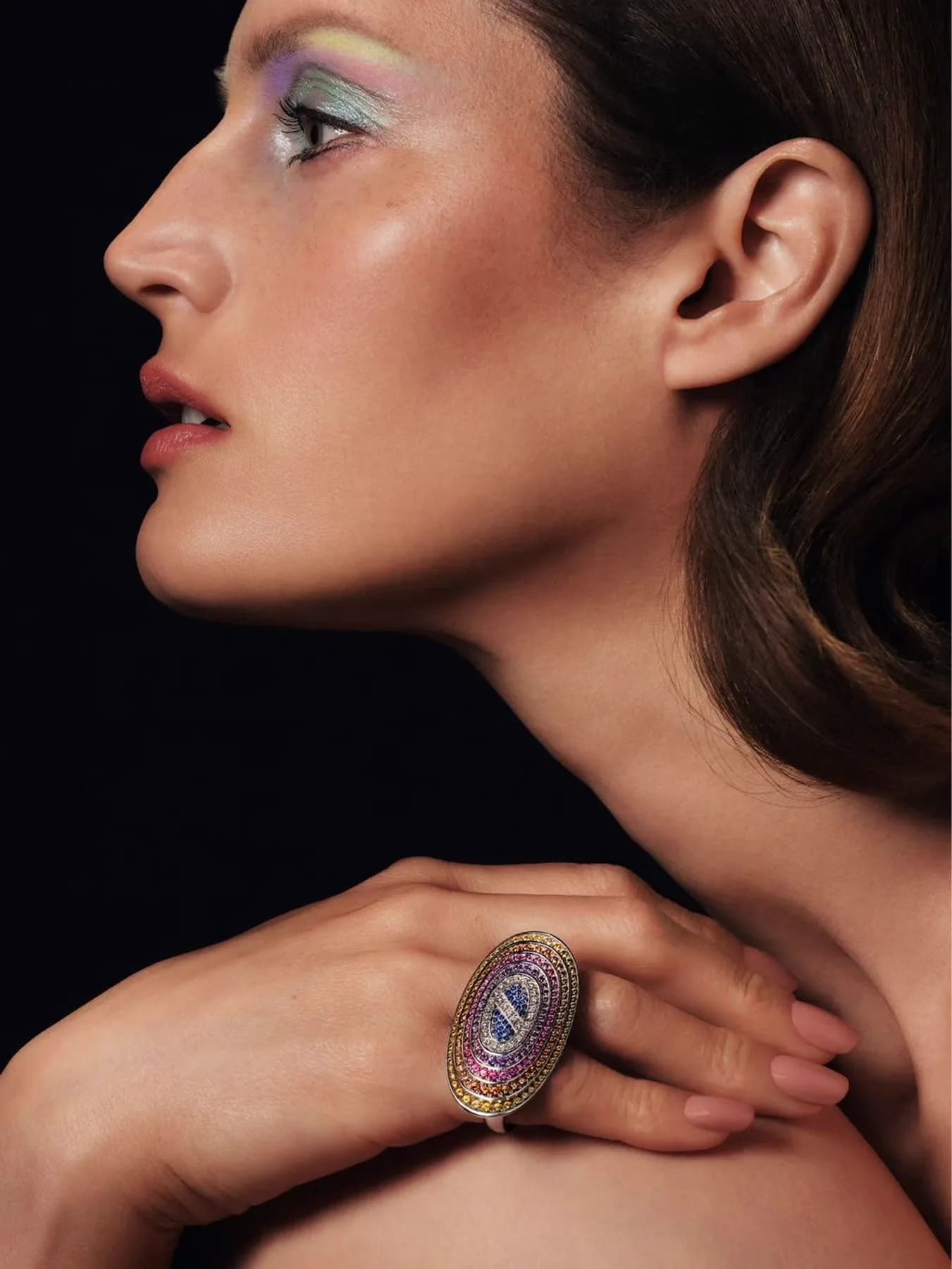 A model wearing a bespoke 7MARK multi-gemstone cocktail ring